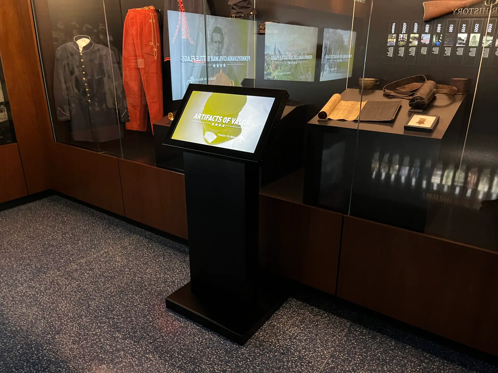 Honoring History: Exhibit Studios' Remarkable Civil War Battle Flag Exhibit Exhibit Studios touch screen on pedestal. Custom made by exhibit studios