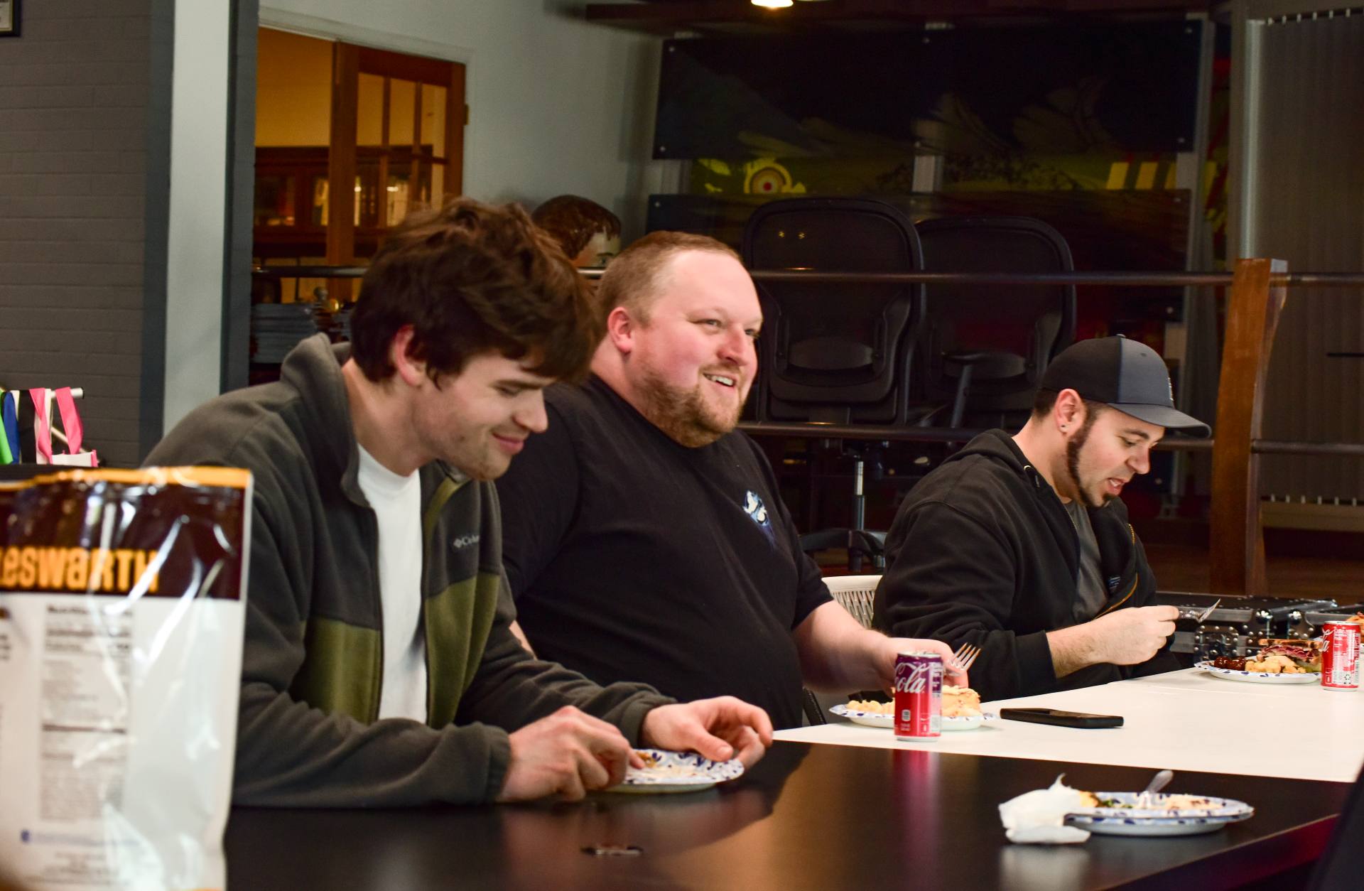 employees sitting at a table at a company celebration