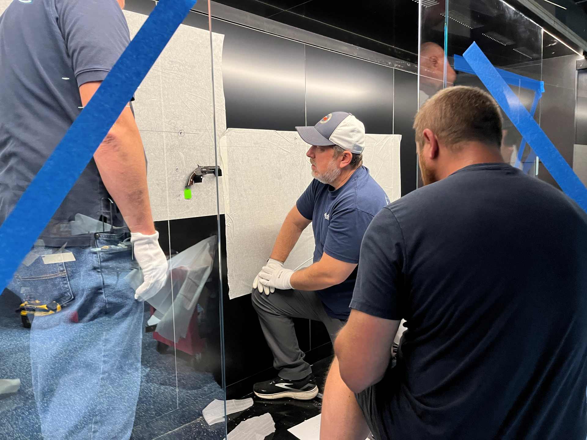 employees working on museum exhibit