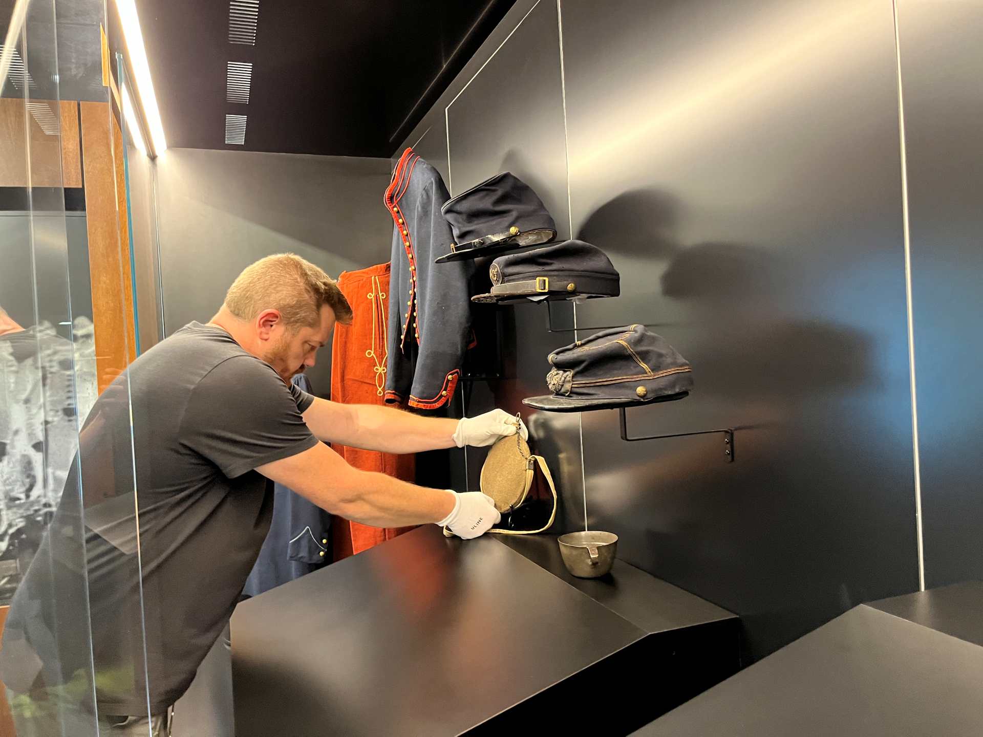 employee working on museum exhibit
