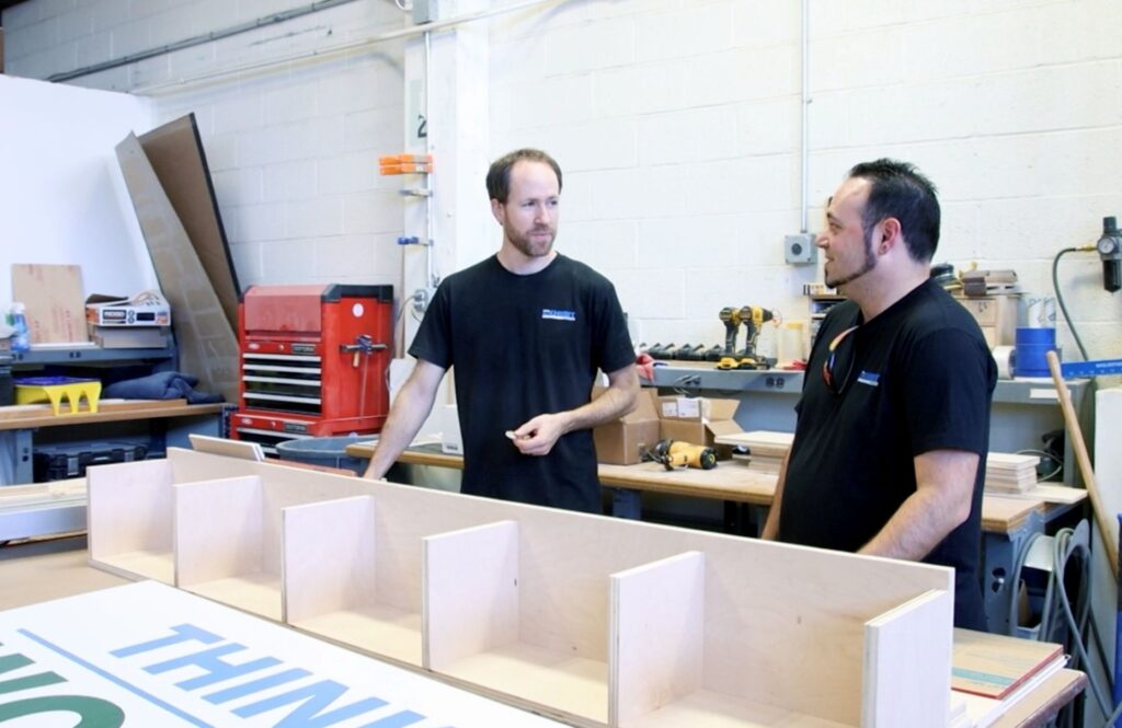 employees working on museum exhibit