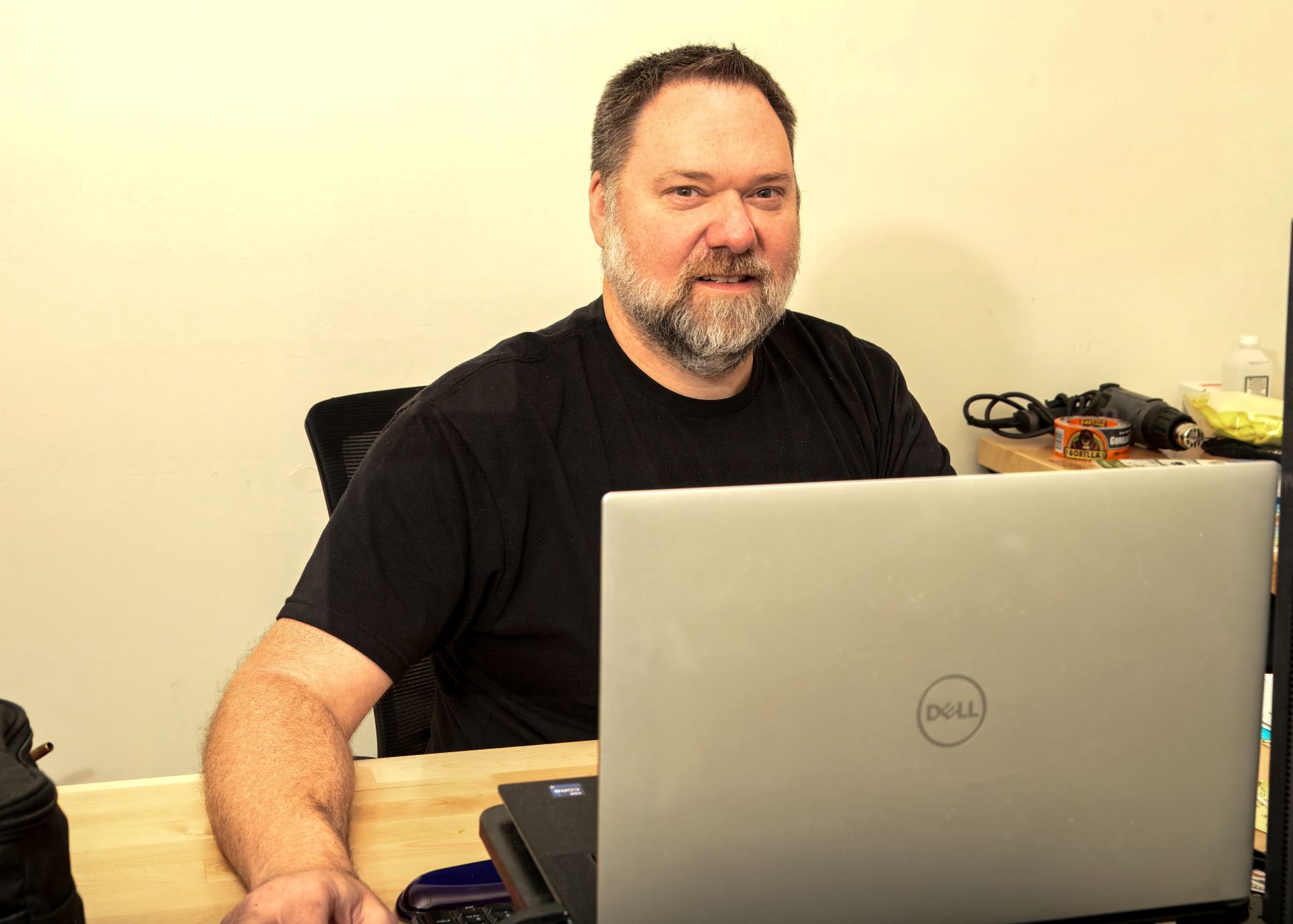employee working on laptop at desk