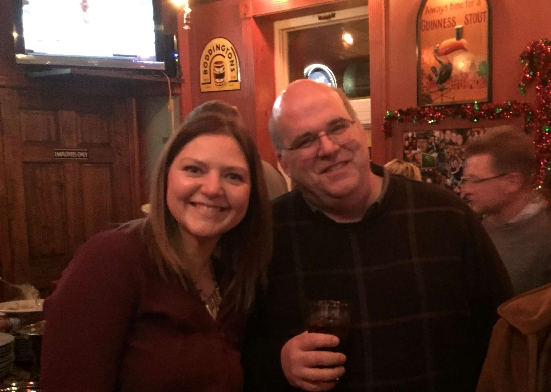 two employees at a holiday party