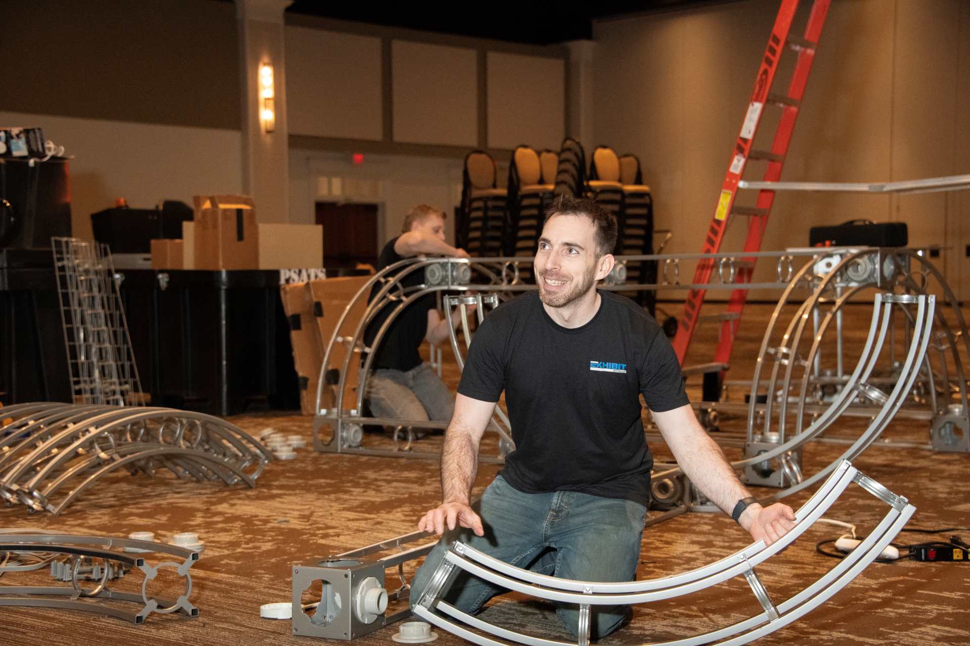 employee working on trade show exhibit