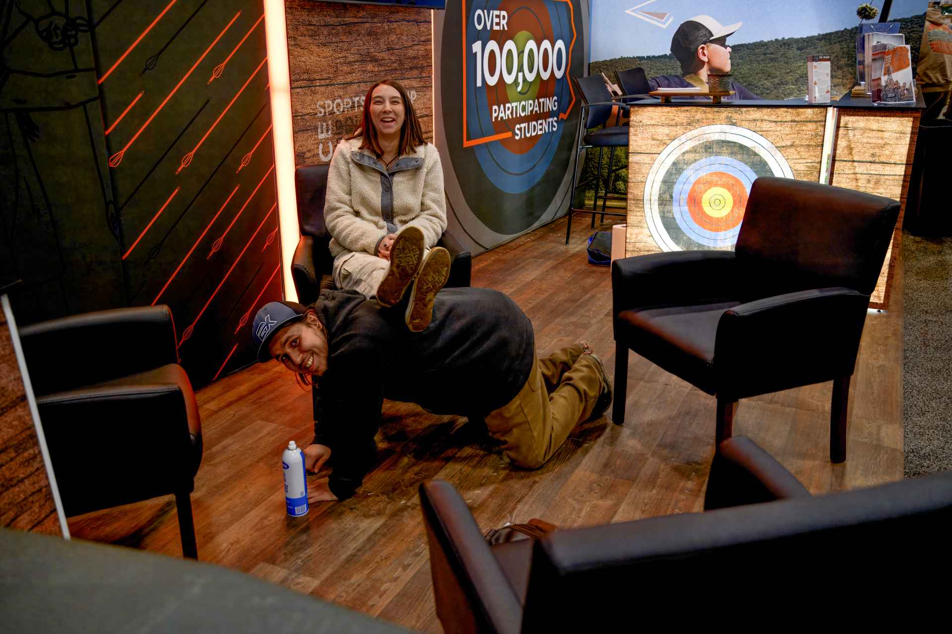 employees joking in sitting area of the office