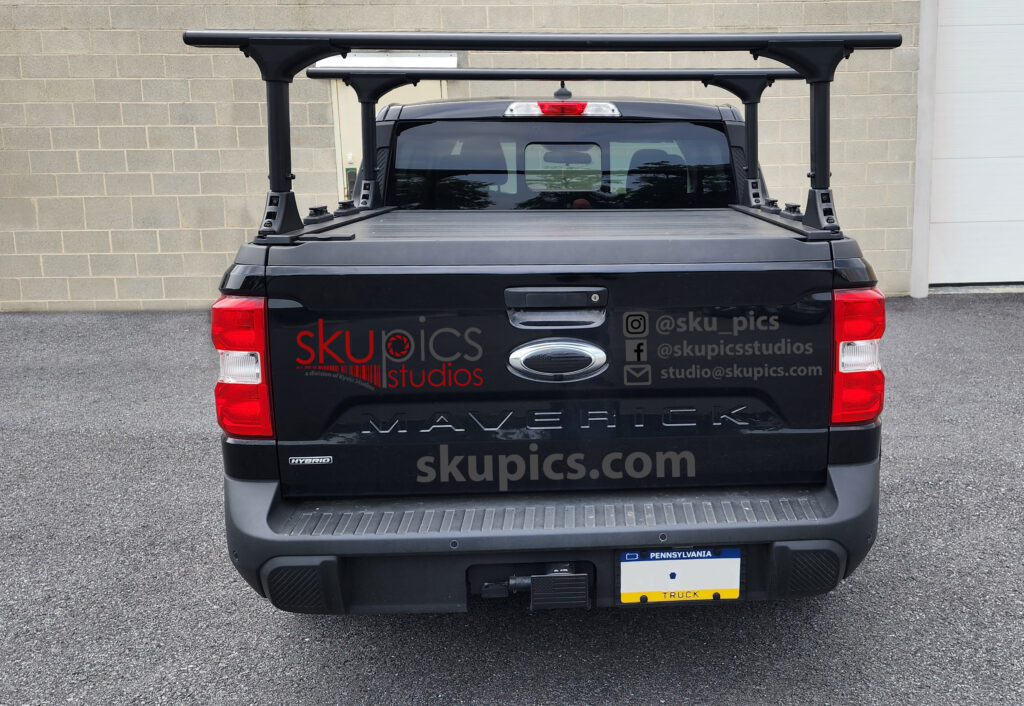 black truck with vehicle wrap