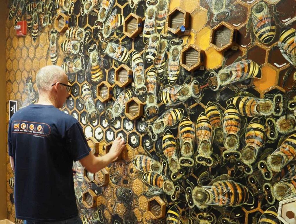 Exhibit Studios employee working on a museum exhibit