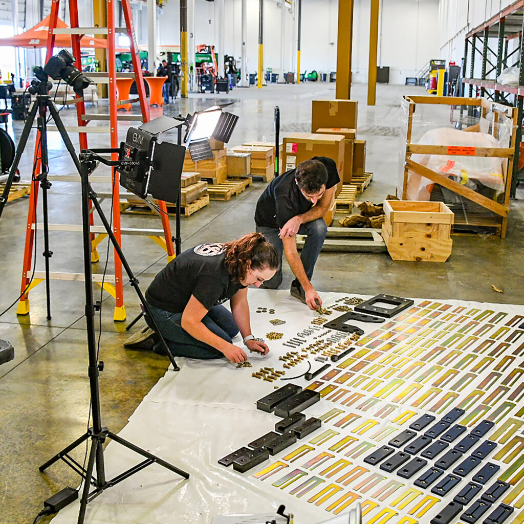photographers organizing products for their client, JLG