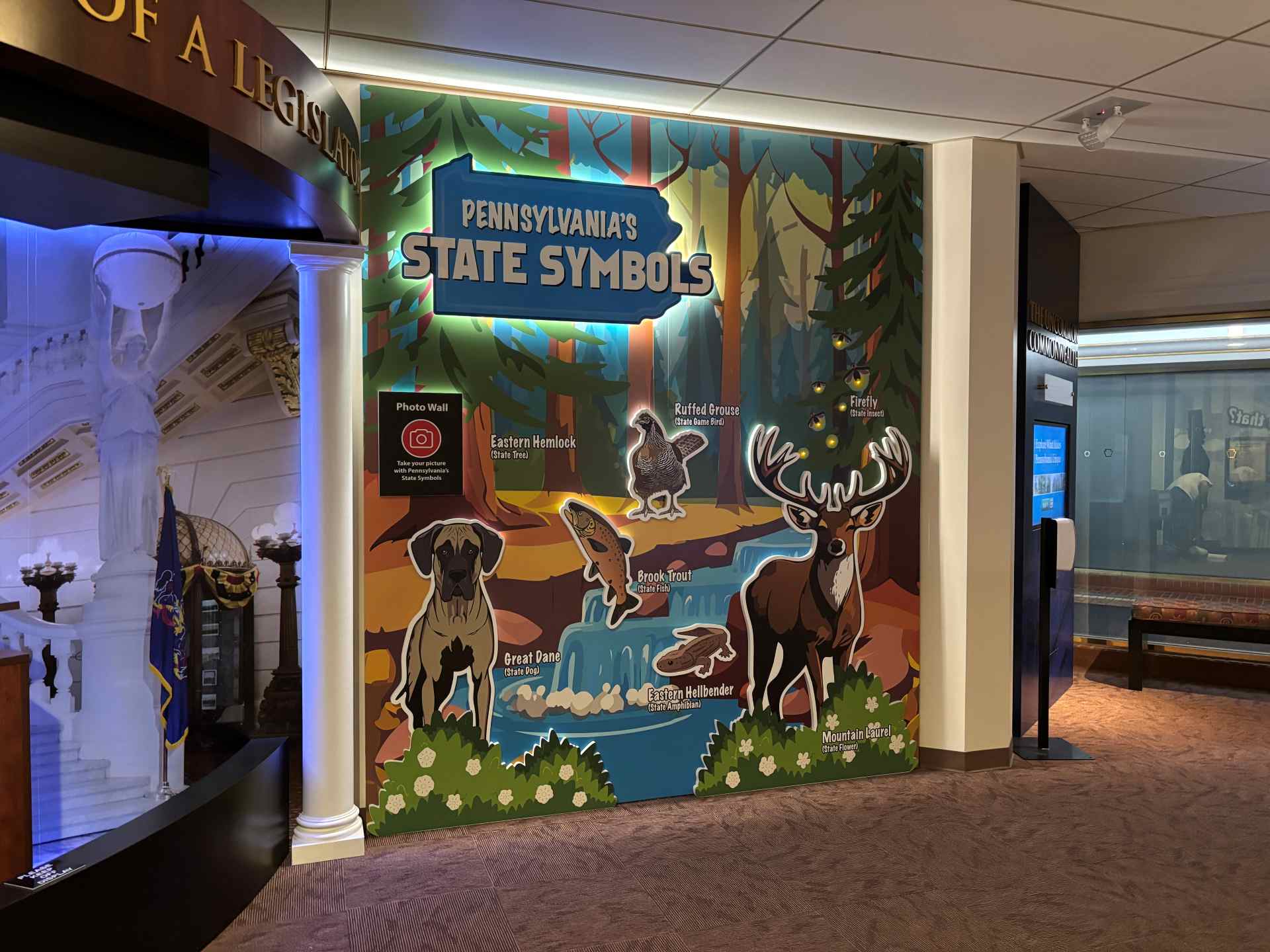 PA State Capitol Welcome Center wall with Pennsylvania's state symbols