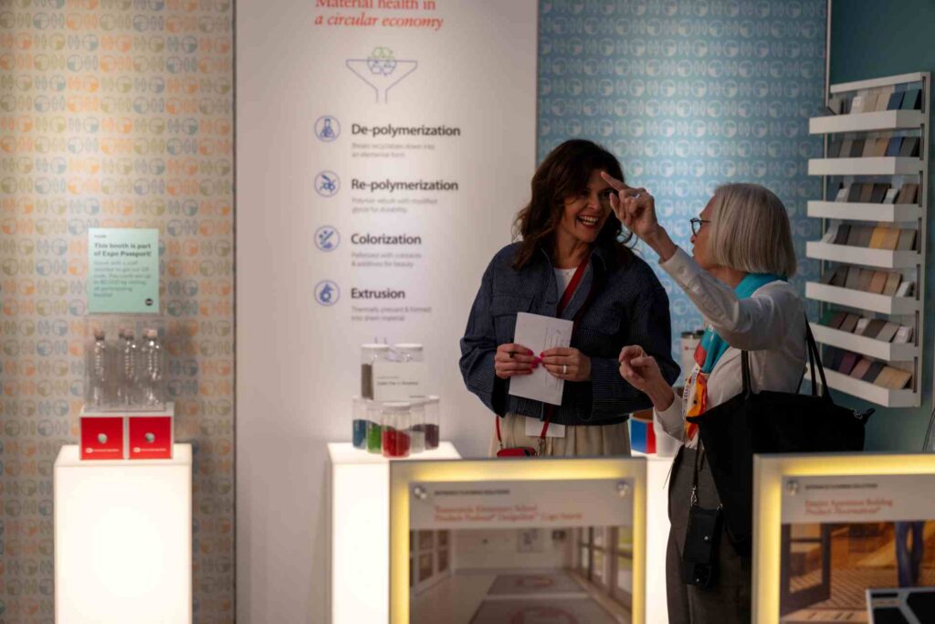 two women talking in trade show booth