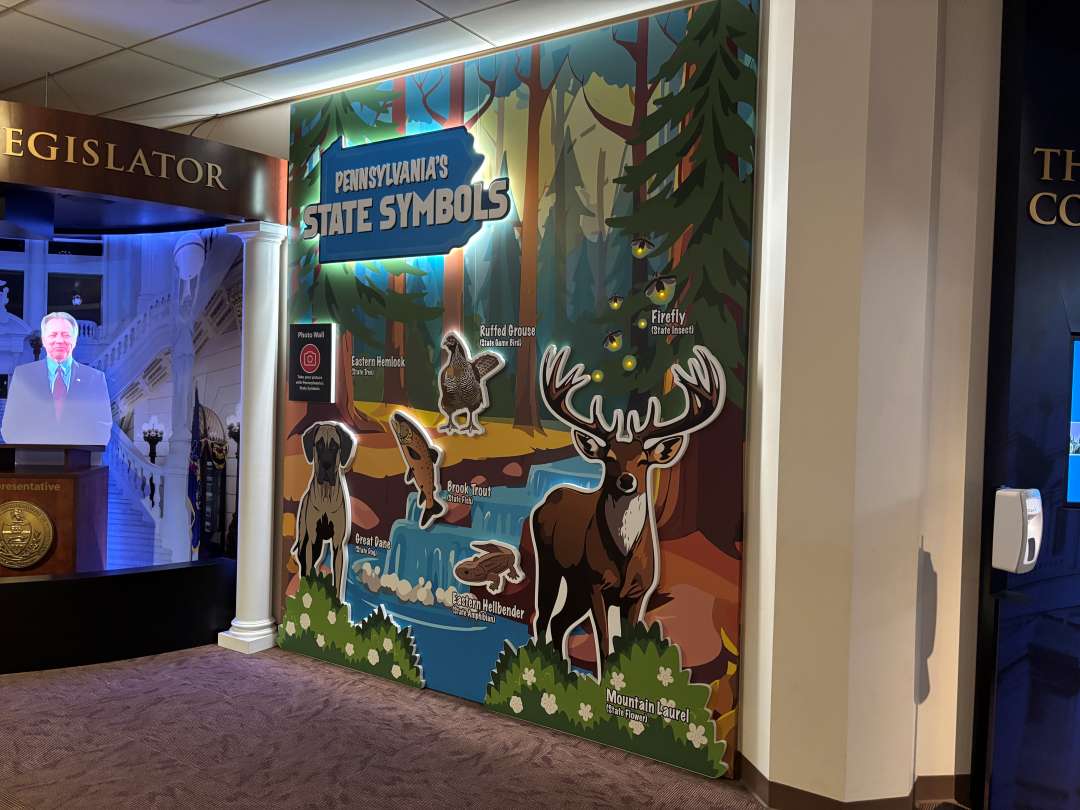 PA Capitol welcome center wall where children can take photos with it