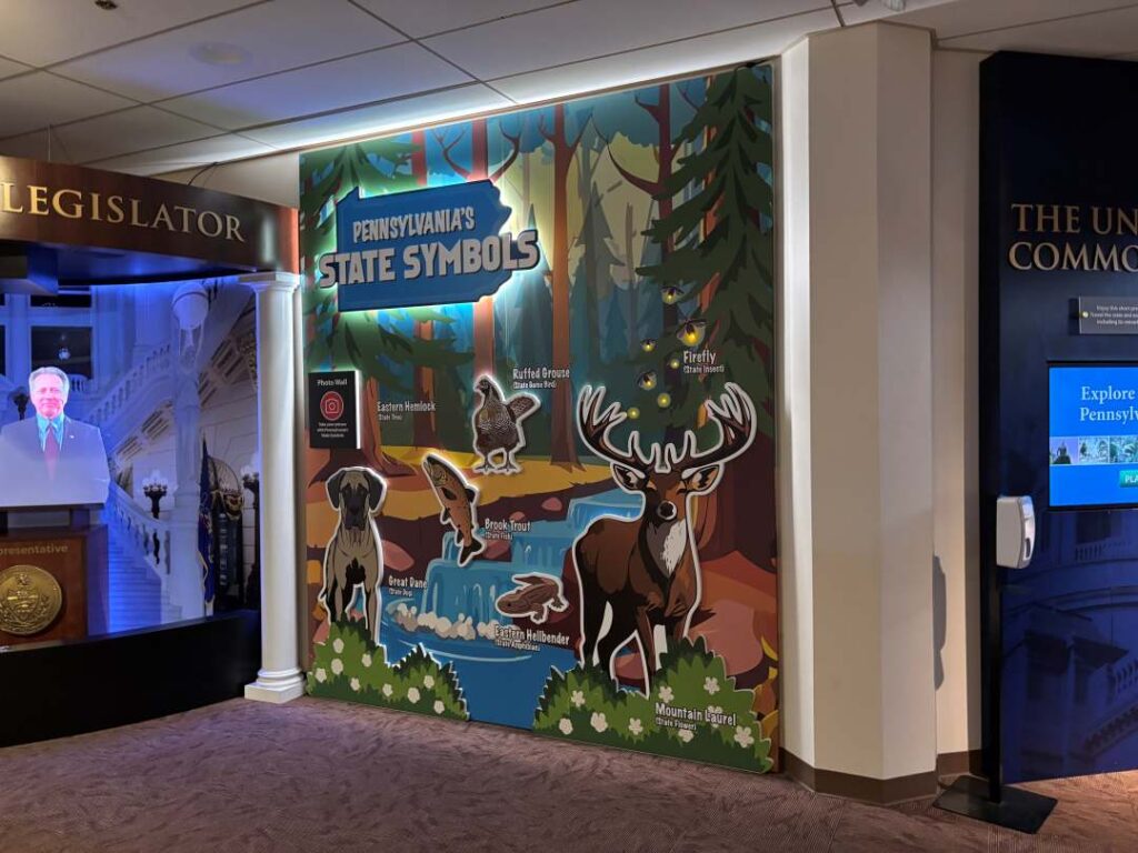 PA Capitol welcome center wall where children can take photos with it