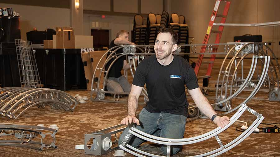 Exhibit Studios employee showcasing trade show logistics