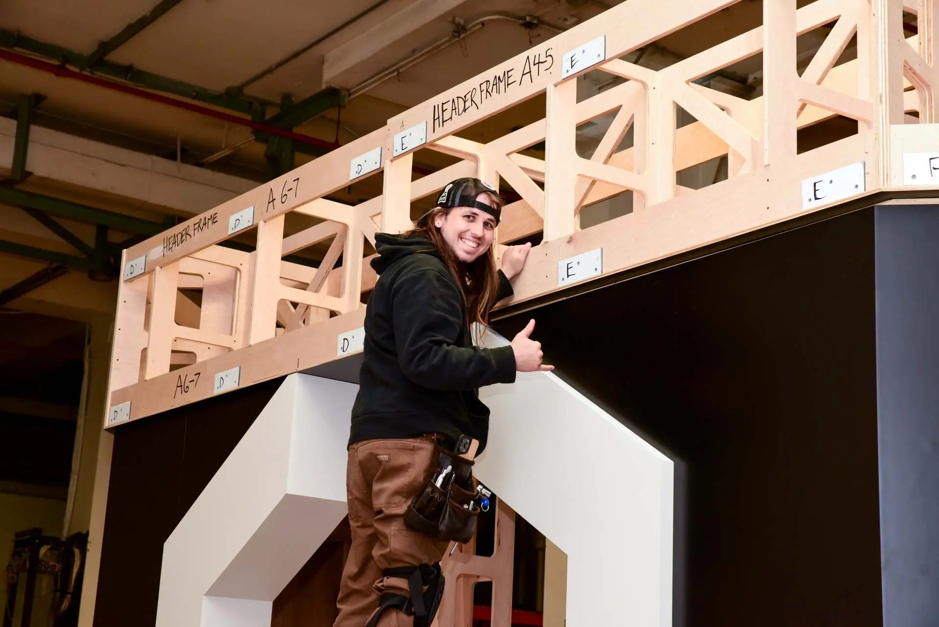 Exhibit Studios employee showcasing trades how logistics