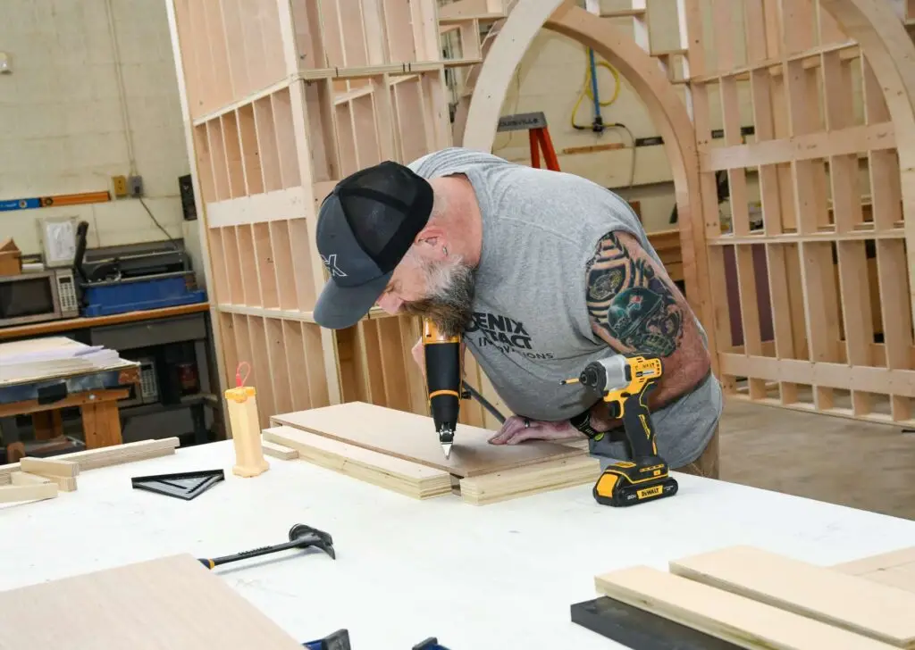 Exhibit Studios employee working on a project in their woodshop