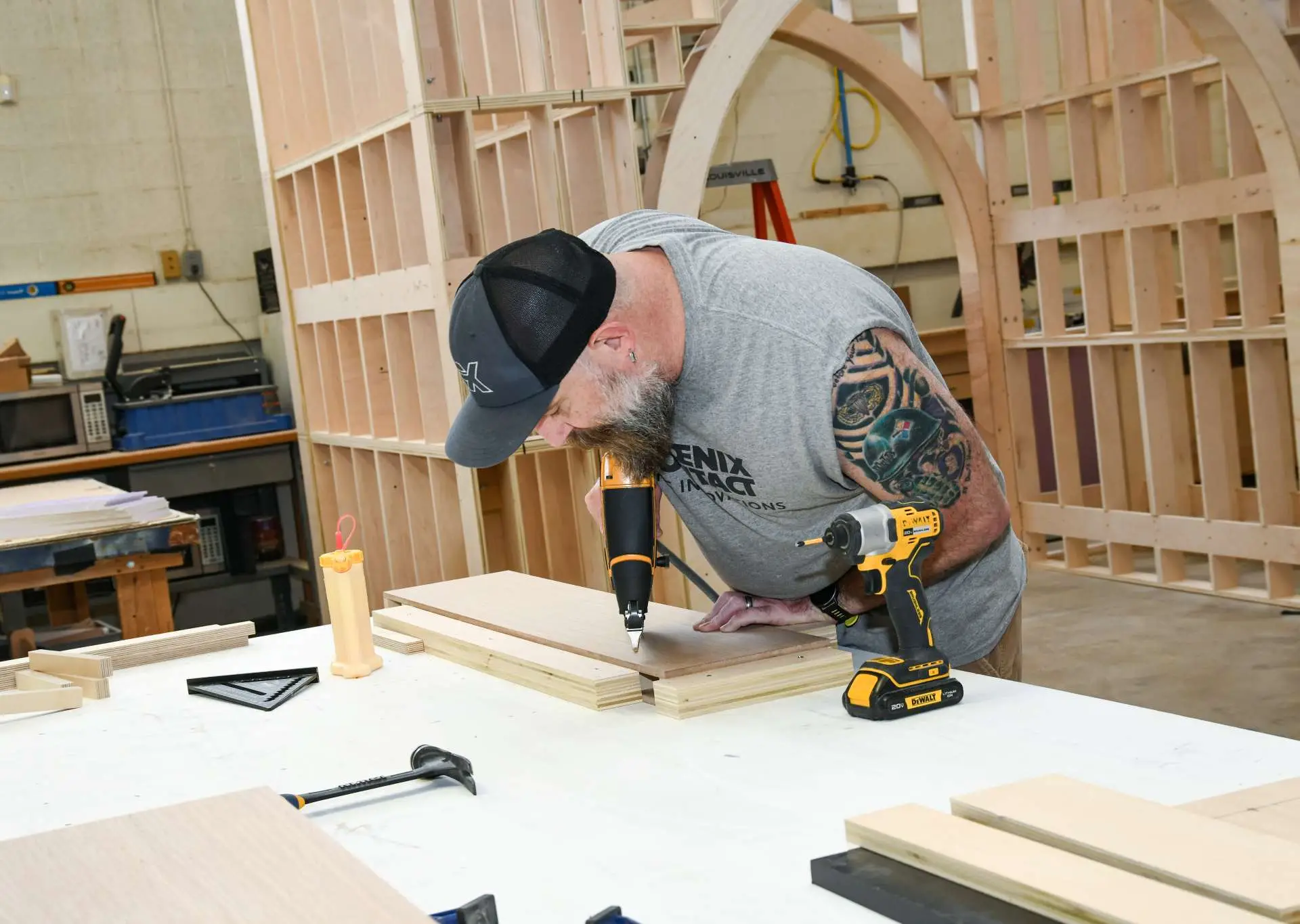 Exhibit Studios employee working on a project in their woodshop