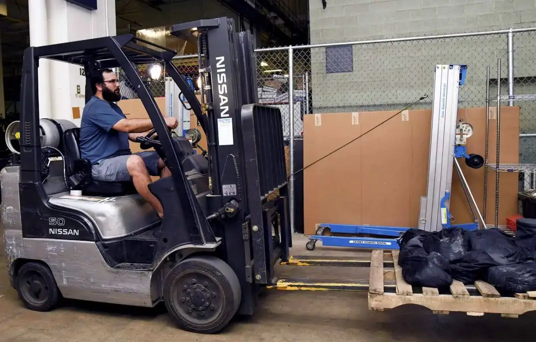 Exhibit Studios employee showcasing trades how logistics