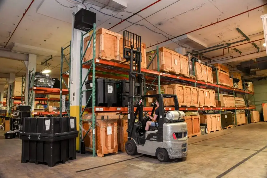 trade show storage warehouse interior with racked exhibit crates